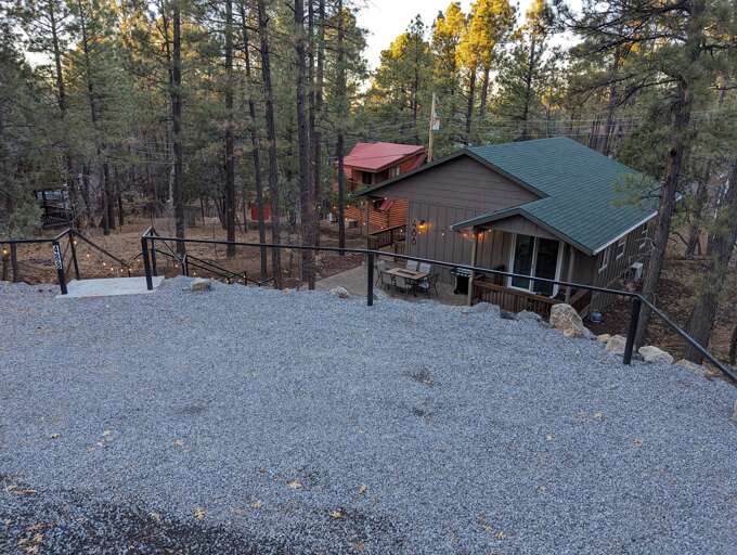 The parking area and stairway to the cottage
