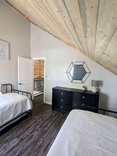 Guest bedroom one has a dresser as well