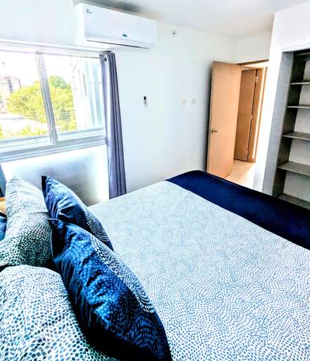 Guest bedroom with double bed and full closet