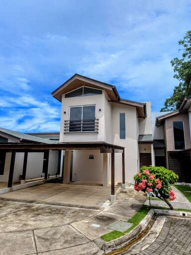 Front view of the home with two parking spots