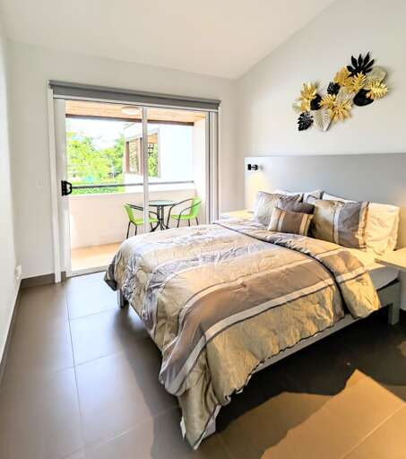 Guest bedroom 1 with queen bed and lots of closet space