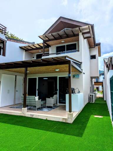 Side yard and covered patio, and balconies