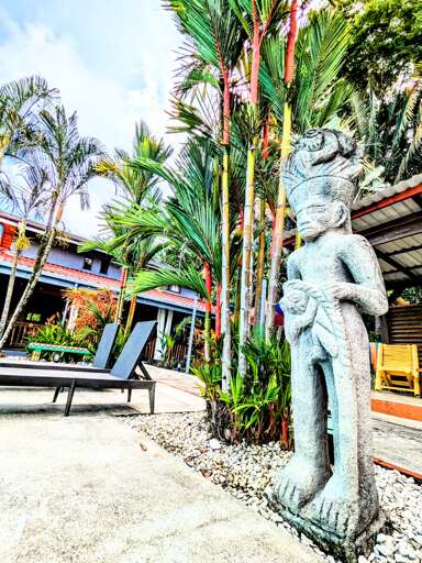 Tropical Garde Statue and Sun Loungers