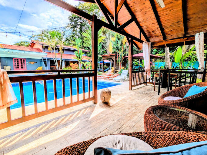 Patio view of pool and across is Cabina Plumeria