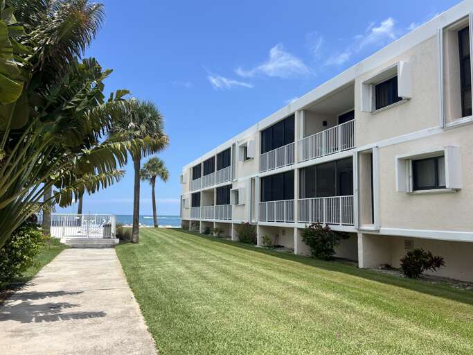 Pathway leading to the large heated pool at Royal Plum Club Condominiums
