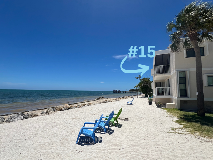 Condo #15, located on the 2nd floor, offers stunning ocean views and is depicted in the right building in this photo