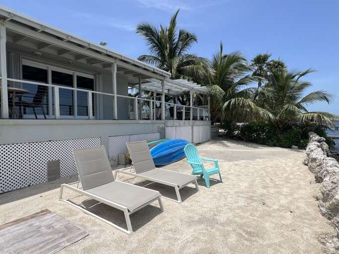 Unwind on the Gulf-front loungers and soak up the sun, steps away from your private retreat Unwind on the Gulf-front loungers and soak up the sun, steps away from your private retreat