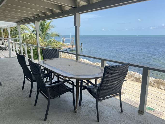 Dine with a stunning Gulf-front view right on your private patio Dine with a stunning Gulf-front view right on your private patio