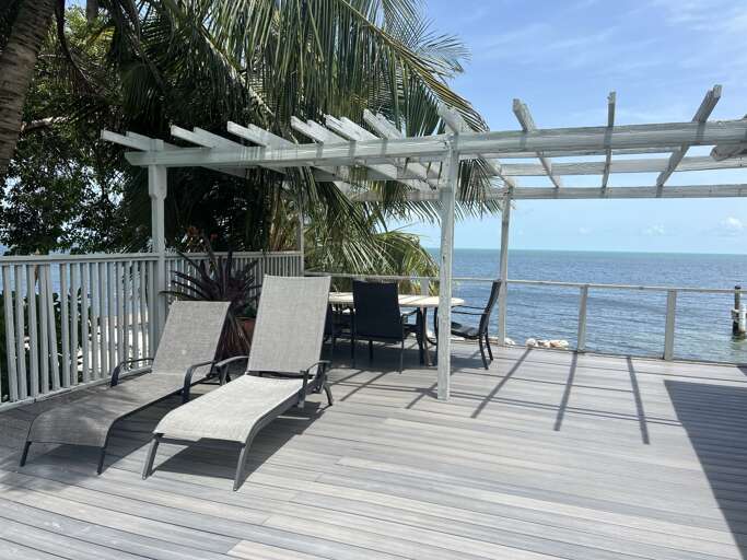 Relax on the spacious Gulf-front deck, complete with loungers and an outdoor table with chairs for ultimate comfort Relax on the spacious Gulf-front deck, complete with loungers and an outdoor table with chairs for ultimate comfort