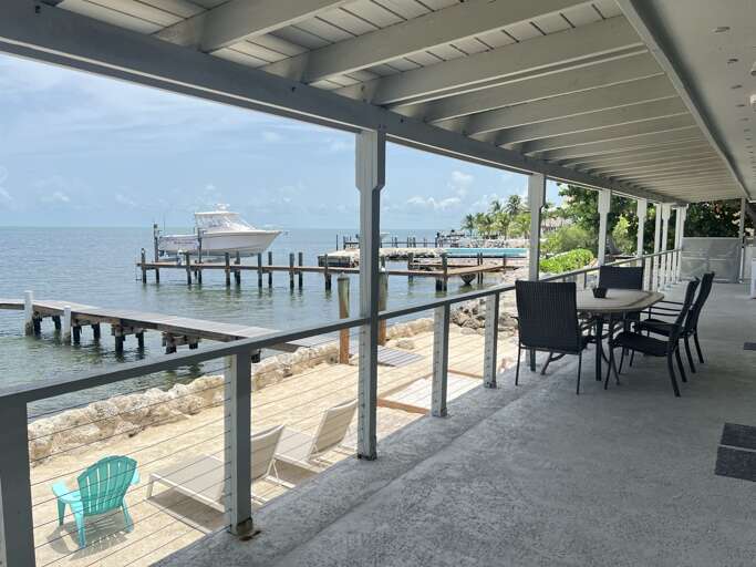 Dine with a stunning Gulf-front view right on your private patio Dine with a stunning Gulf-front view right on your private patio