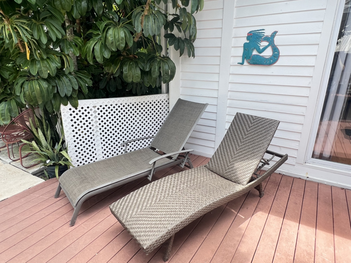 Unwind in your private tropical oasis, where lush greenery surrounds a serene pool. Sip your morning coffee or enjoy an al fresco meal on the spacious deck