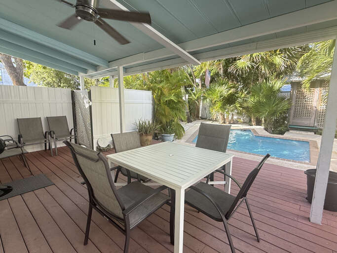 Unwind in your private tropical oasis, where lush greenery surrounds a serene pool. Sip your morning coffee or enjoy an al fresco meal on the spacious deck.