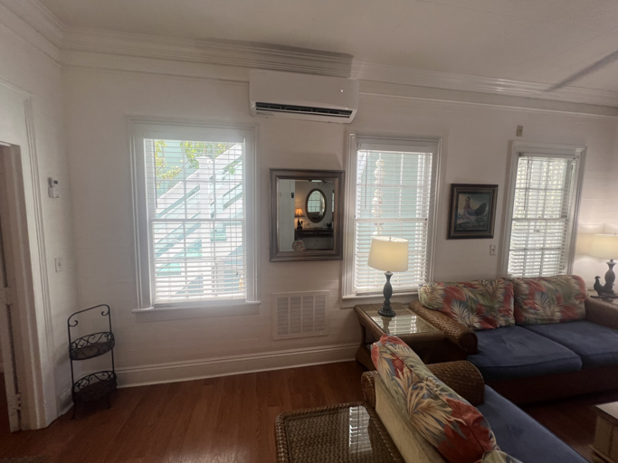 Enjoy the bright and airy feel of this living room, with plenty of space to relax. It connects to the dining area, making it perfect for socializing and hanging out with friends and family.