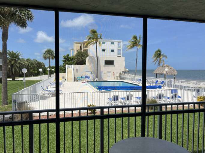 Enjoy pool and ocean views from the patio.
