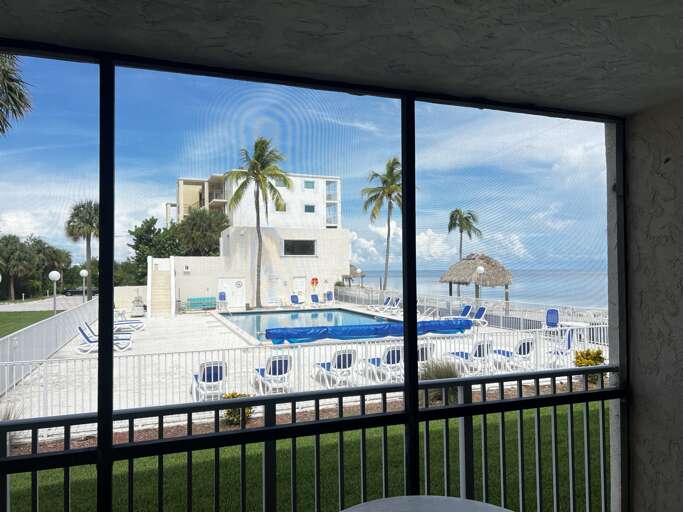 Enjoy pool and ocean views from the patio.