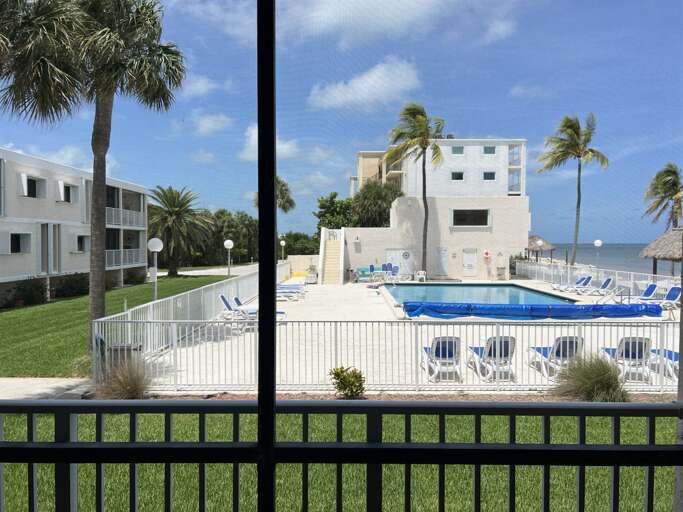 Enjoy pool and ocean views from the patio.