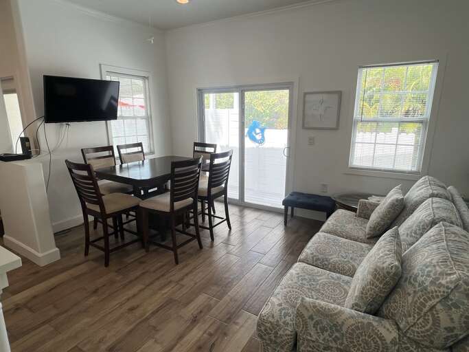 Bright and open kitchen and dining area, perfect for cooking meals and gathering around the table. Enjoy all the comforts of home with plenty of space to dine and relax.