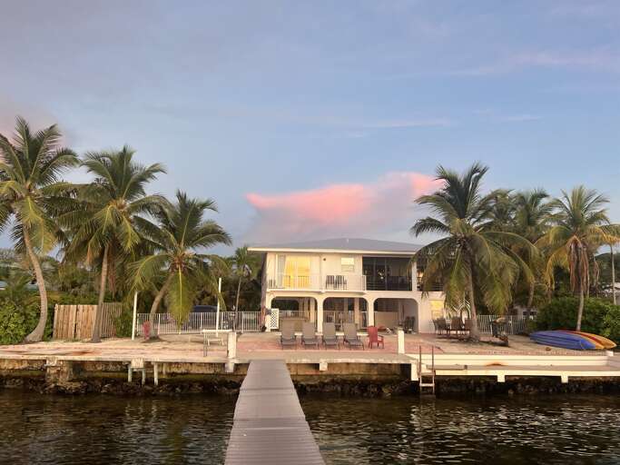 Enjoy waterfront living at its finest, with direct access to the dock and plenty of space to relax by the water. Perfect for sunset views and boating adventures.