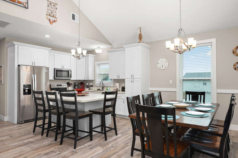 4 at kitchen bar and 8 at the dining table.