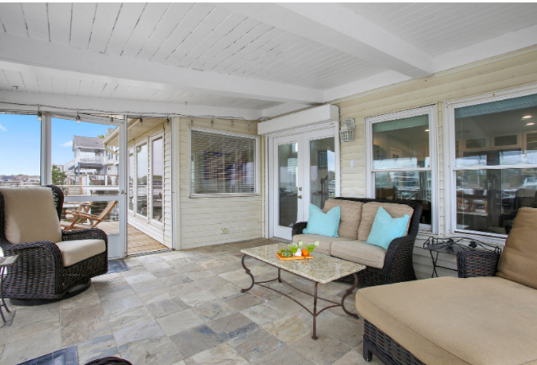 Enclosed patio with plenty of seating and a great place to hang after a long day fishing or swimming.