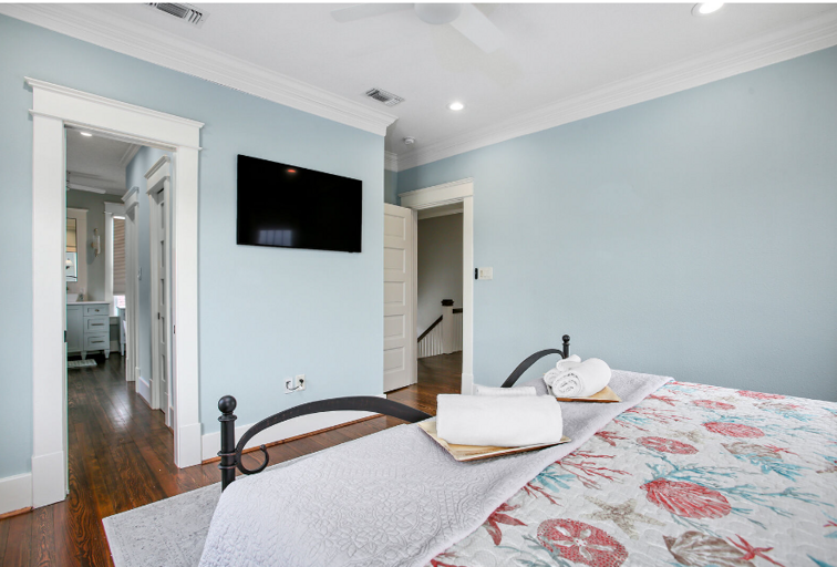 Ah, luxury...Master bedroom with king bed and TV with streaming service.  Bright and beautiful, with shades that can be lowered for sleeping.