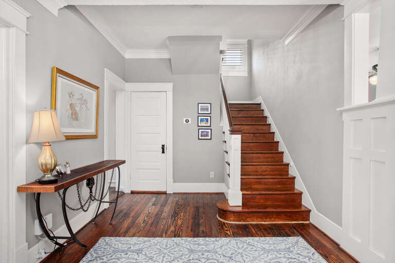 Entryway...Half bath is behind white door.  3 bedrooms are upstairs.  From this area, living is to the right and dining to the left.