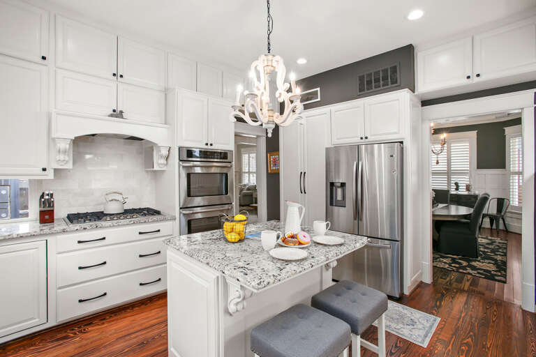 Nice big kitchen stocked with pots, pans, dishes, and utensils needed to prepare a nice meal. Bring your favorite food and drinks!  Kitchen looking into dining area.