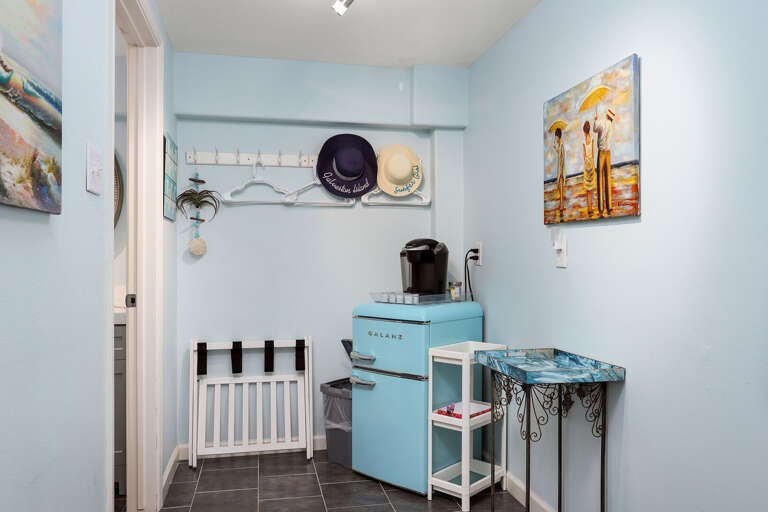 Coffee station in the downstairs private bedroom. Enjoy your own coffee station, a vintage mini frig, and bathroom.