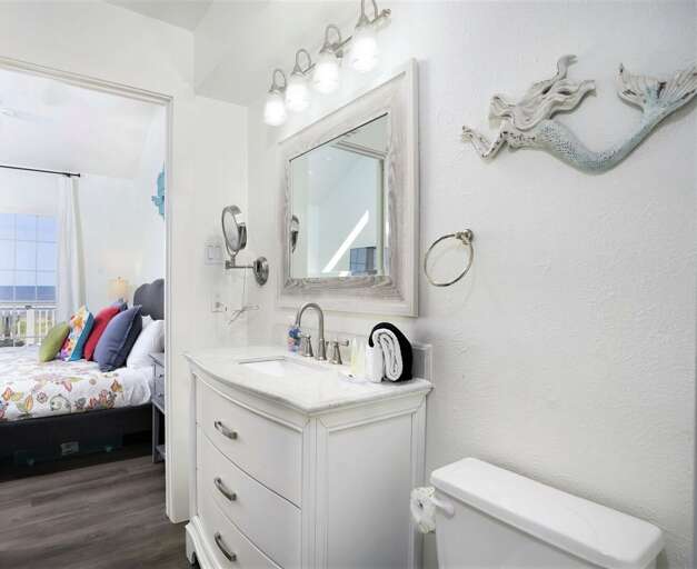 Master bathroom looking out to the bedroom, and ocean view