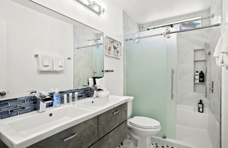 Beautifully updated bath with double sinks and large walk in shower.