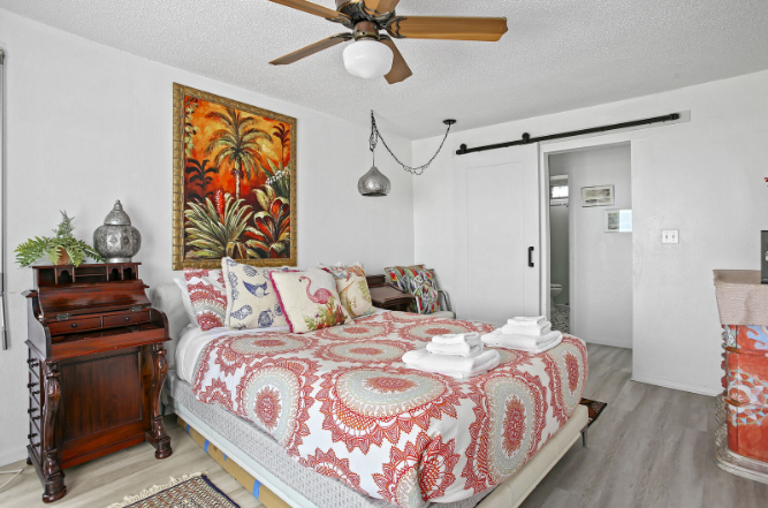 Cool, coastal vibe, with fun colors.  Master leads to a shaded balcony area, for your enjoyment.