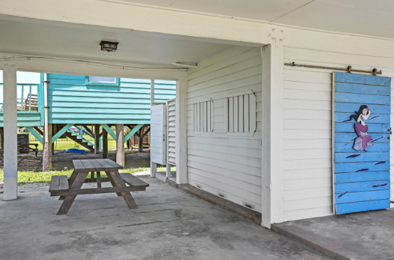 Picnic table and a charcoal grill allow for a fun bar-b-que any time of the day!