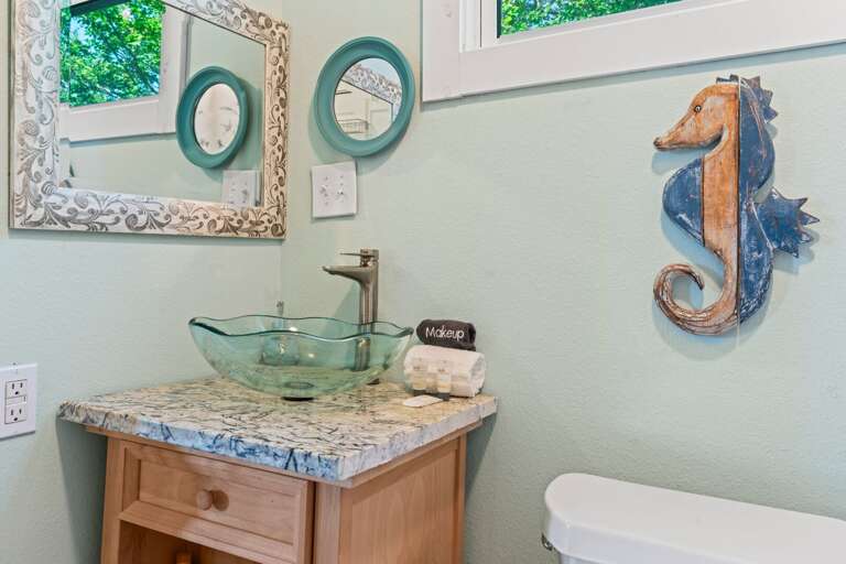 Bathroom 2 w/ hair dryer for use. The mirror has been changed.