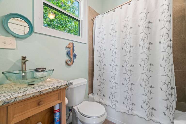 Bathroom 2 w/ tub shower combo. Towel hooks available.