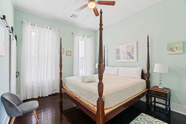 Bedroom w/ King size bed, luggage racks, and a full-length mirror!