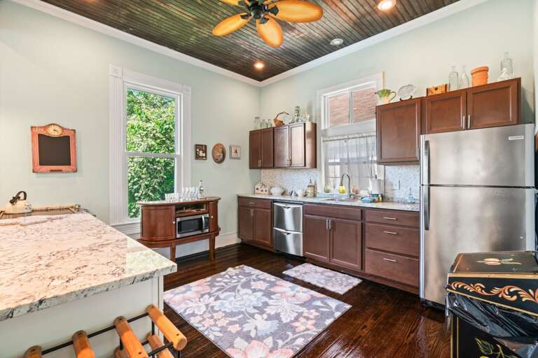 Kitchen has a spice rack, Keurig, toaster, grilling utensils, knife block set, cutting boards, and more!