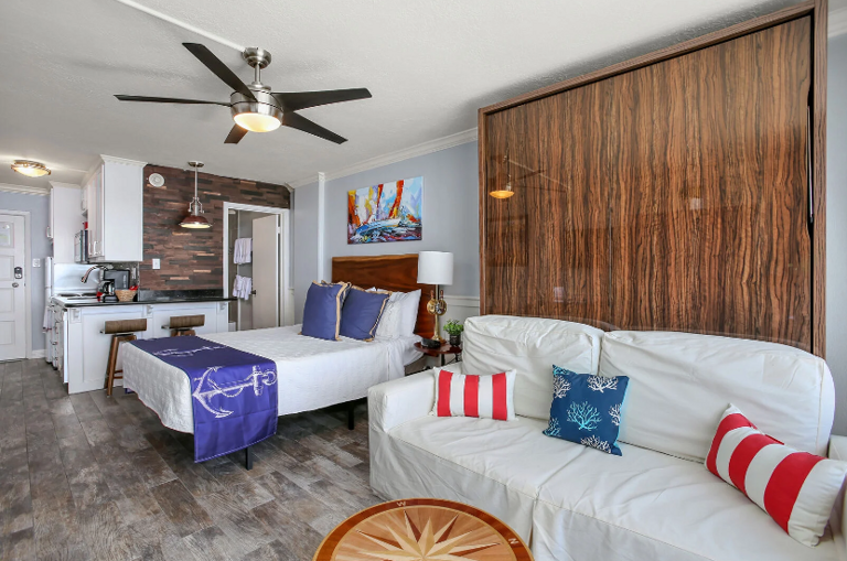 Remove cushions from couch and pull down the murphy bed for additional sleeping space Remove cushions from couch and pull down the murphy bed for additional sleeping space