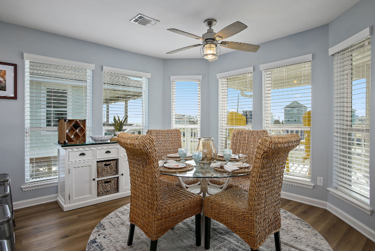 Dining room with lots of windows.  Bright and enjoyable