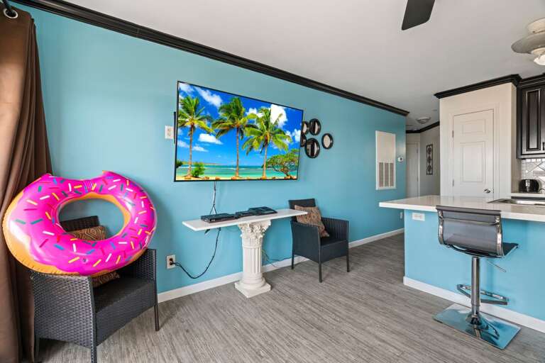 Bright Blue Room With Beach-themed Art And Float Ring Bright Blue Room With Beach-themed Art And Float Ring
