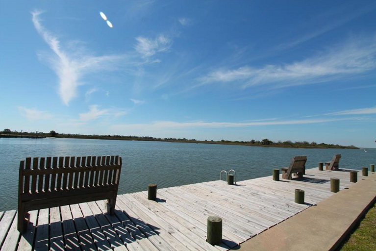 Sit, relax and fish off the neighborhood dock!  This area is off a large covered pavillion and green space.  Lots of room to run and play.