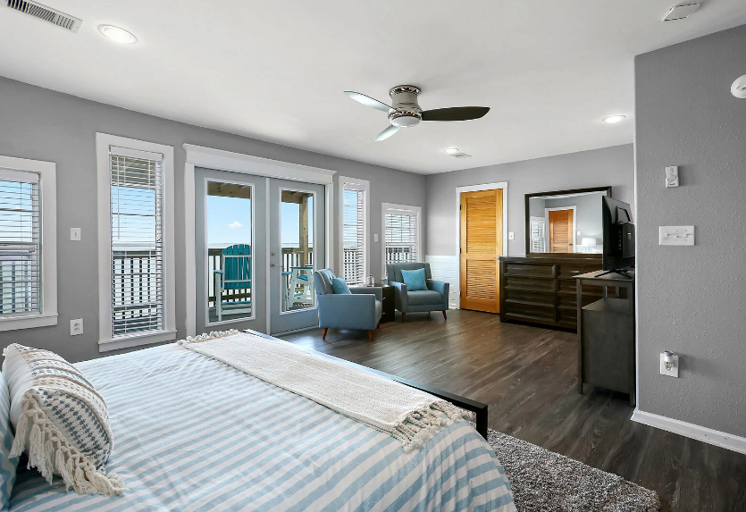 Spacious master with deck, streaming TV, and sitting area Spacious master with deck, streaming TV, and sitting area