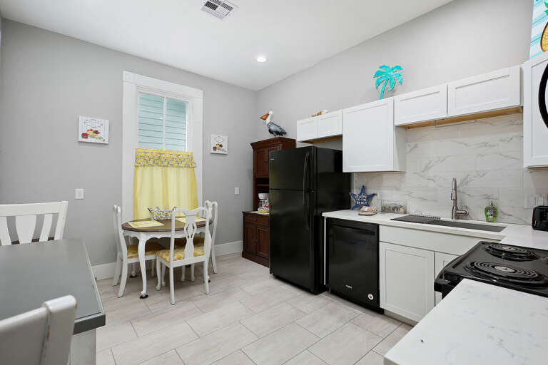 Large open kitchen with dining table seating up to 4. 
Additional breakfast table seating for 2.