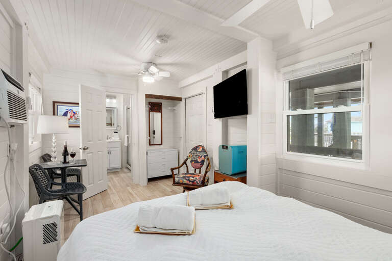 Mother-in-law Suite features its own private entrance, deck, tv, queen size bed, and en suite guest bathroom
