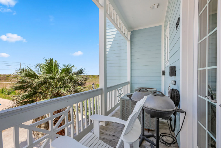 Back balcony, (over driveway).  Two electric grills for cooking out. Back balcony, (over driveway).  Two electric grills for cooking out.