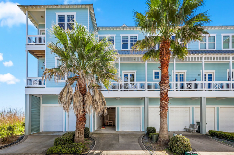 This is the back, showing driveway and entry into garage/Gameroom. This is the back, showing driveway and entry into garage/Gameroom.