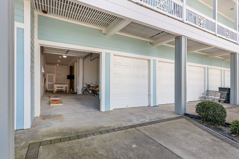 This is the back, showing driveway and entry into garage/gameroom. This is the back, showing driveway and entry into garage/gameroom.