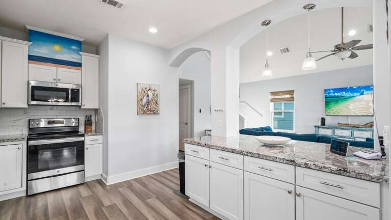 Kitchen overlooks the living area.