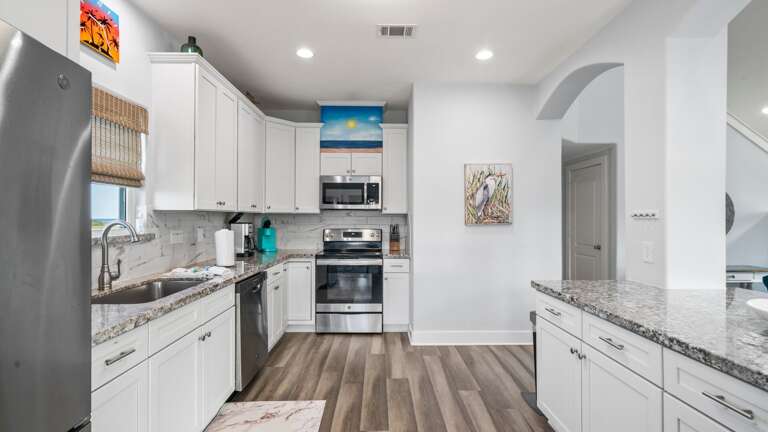 Spacious kitchen w/ modern appliances.