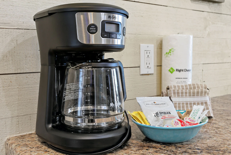 Comes with 2 packs of coffee that make 10-12 cups each, with creamer, sugar, and sweetener