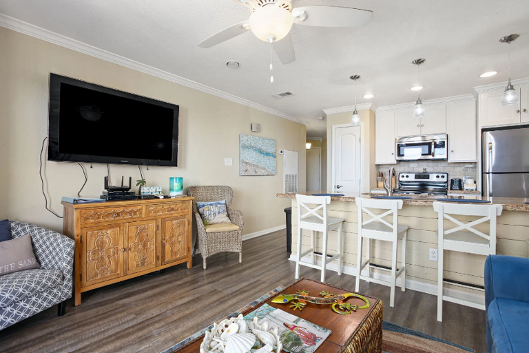 Enjoy a good movie on the big screen tv at the end of a long day at the beach!